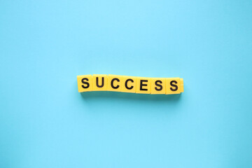 Success concept. Lettering from yellow cubes.