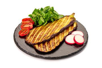 Grilled spicy eggplants on a black plate, isolated on white background.