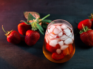 Refreshing summer cocktail with strawberries and ice cubes. Strawberry Homemade Lemonade