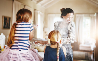 Mom, playing or kids baking with flour in messy kitchen with children siblings laughing together at...