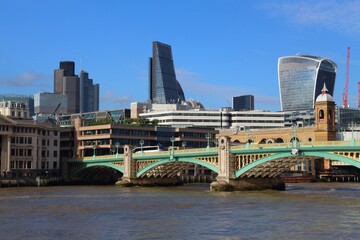 London, UK - Southwark Bridge with City of London skyline in background.