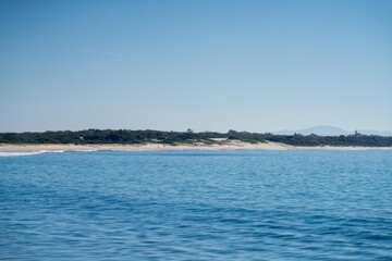 looking down on a beach seascape landscape in a national park at hawksnest australia