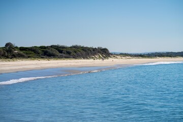 looking down on a beach seascape landscape in a national park at hawksnest australia