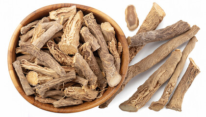 Calamus root in wooden bowl, isolated on white background. Sweet flag, sway or muskrat root. Dry root of Acorus calamus.