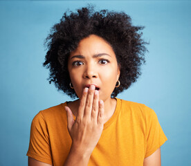 Surprise, portrait and emoji with woman and expression, shocking news and hand on mouth on blue background. Wow reaction, emotion and female person in studio, alarm and gossip with announcement