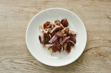 spicy and sour Chinese pork sauce with shallot salad on plate 