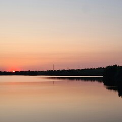 A body of water with a lightning bolt in the sky
