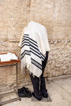 Jewish man praying at the Western wall