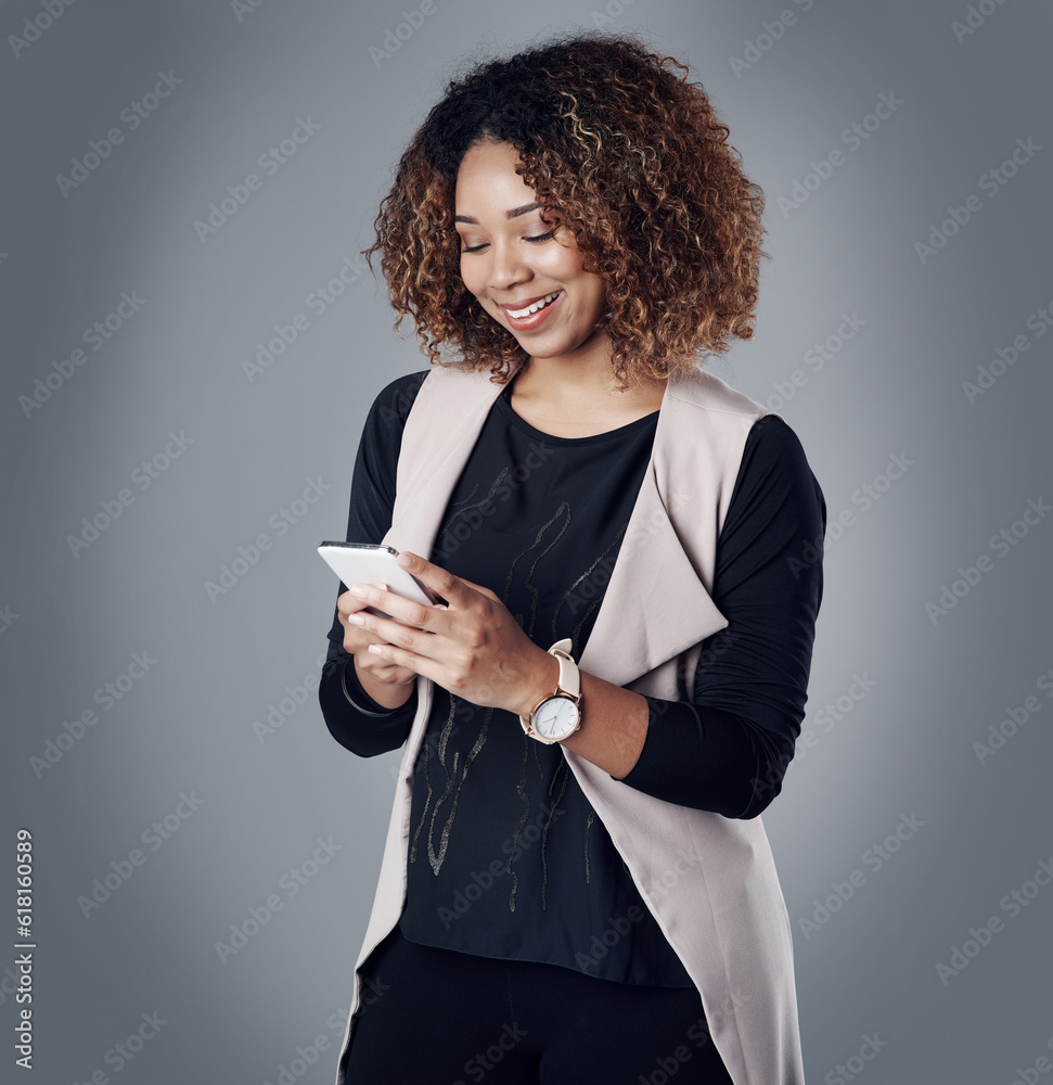 Sticker Business, happy and woman with a smartphone, typing and online reading on a grey studio background. Female person, employee and consultant with a cellphone, search internet and website information