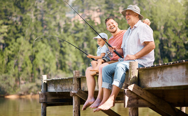Happy father, grandfather and child fishing at lake together for fun bonding or peaceful time in...