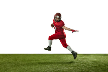 Fototapeta na wymiar Man, american football player in red uniform catching ball and running on field against white background. Concept of professional sport, action, lifestyle, competition, hobby, training, ad