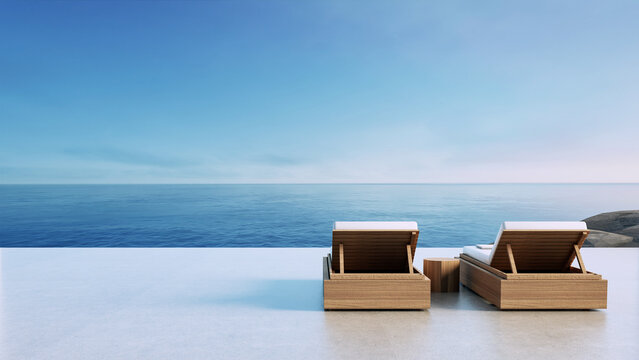 Luxury beach Lounge chair on the balcony overlooking the sea view - 3D rendering 