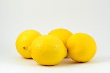 A group of ripe yellow citrus lemon fruit isolated on white background.High vitamin C fruit.