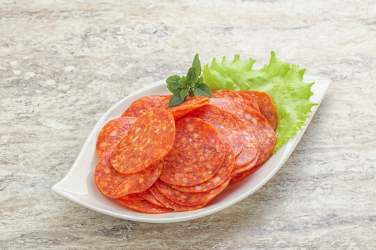 Sliced pepperoni sausage in the bowl
