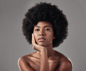 Fototapeta na wymiar Skincare, black girl and makeup with confidence in portrait for wellness in studio background with afro. Beauty, face and glowing skin with african woman with cosmetics for dermatology with makeup.