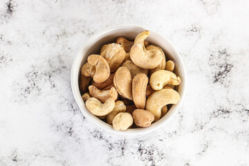 Fototapeta na wymiar Cashew nuts heap in the bowl