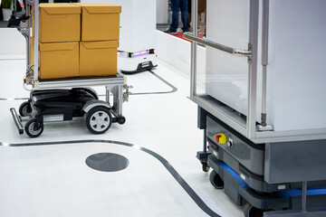 Autonomous Robot and self-driving forklift transporting parcel and stock in warehouse