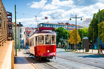 Red vintage tram on the street in Lisbon, Portugal.