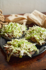 Traditional mexican food: picadillo sopes