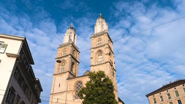 Zoom in time lapse of two bell towers of the Grossmunster reformed church in Zurich, Switzerland