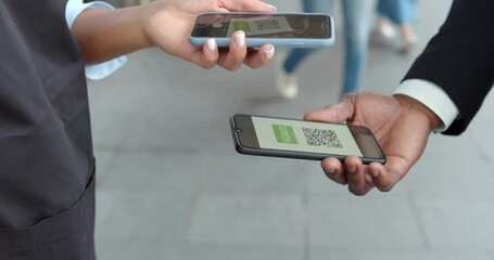 Cropped shot of restaurant worker scanning qr code of vaccination digital passport on smartphone app - Powered by Adobe