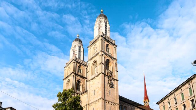 Zoom in time lapse of two bell towers of the Grossmunster reformed church in Zurich, Switzerland