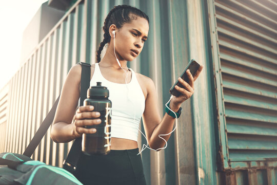 Earphones, mobile app or happy girl runner in city streaming music to start training, workout or exercise. Social media, bag or sports woman athlete listening to radio or fitness podcast to relax
