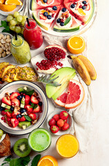 Summer fruits assorted on white background. Fresh raw food concept.