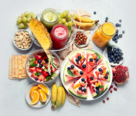 Summer fruits assorted on white background. Fresh raw food concept.