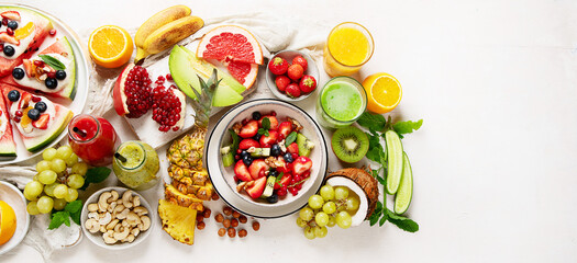 Obraz na płótnie Canvas Summer fruits assorted on white background. Fresh raw food concept.