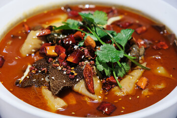 close up duck blood curd in chili sauce. Traditional spicy Chongqing and Sichuan cuisine.