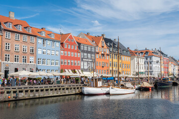Fototapeta na wymiar Nyhavn (Danish: New Harbour) is a 17th-century waterfront, canal and entertainment district in Copenhagen, Denmark