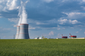 Cooling towers of nuclear power plant against the blue sky