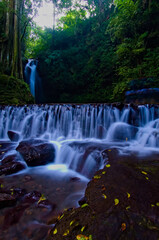 Fototapeta na wymiar beautiful view of waterfall, water flow in river with waterfall view