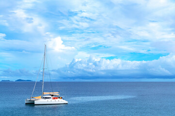 Fototapeta premium Sailing boat in calm blue sea