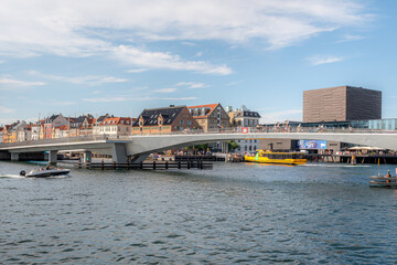 Fototapeta na wymiar Inderhavnsbroen is a bridge across the Copenhagen inner harbour and is a 180 metres (590 ft) combined pedestrian and bicyclist bridge directed east-west
