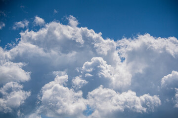 Fototapeta na wymiar White clouds floating on blue sky at sunny day
