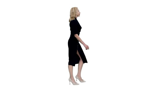 Side view elegant blonde mid adult business woman walking in black dress, Full HD footage with alpha transparency channel isolated on white background 