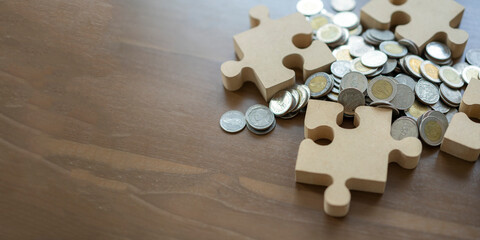 jigsaw puzzle and money coin, financial and investment concept