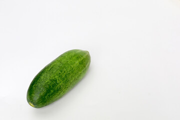 Fresh green and healthy cucumbers on wooden board