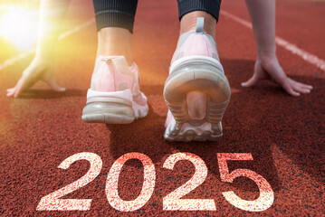 Women's feet on the road, run, the beginning of the New Year 2025,