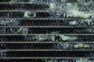 Close up evaporator Dirty cars. Cooling coil air condition car dirty with dust and stick. Nasty with mucus and dust clumping on air fins - obrazy, fototapety, plakaty