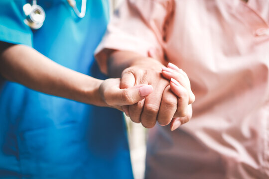 Surgeon shaking hands of elderly patient To encourage the treatment of surgery. concept of medical services in a hospital. nurse taking care of the patient