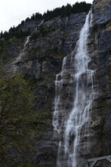 Picturesque view of beautiful mountain waterfall with moss outdoors