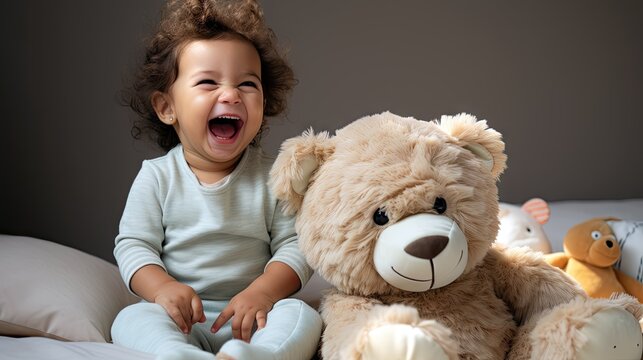 The infant giggles while playing with a stuffed toy, displaying delight.