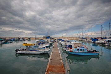 Fishing boats docking to a pier in Jaffa - Israel