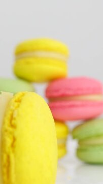 Pile of colorful Macaroons on white background. High quality 4k footage