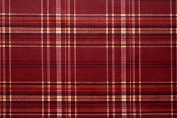 Fabric texture with a checkered pattern in red color.