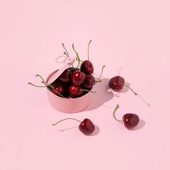 A can full of cherries, creative aesthetic fruit layout, romantic pink style. 
