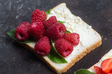 Sandwiches with cream cheese, honey and berries. Dessert